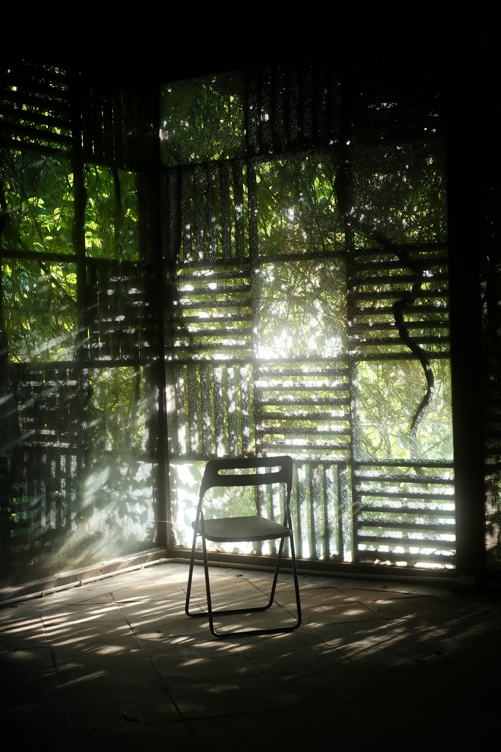 A solitary chair in warm raking window light